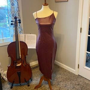 Leather look dress. 95% polyester, 5% Spandex good stretch.